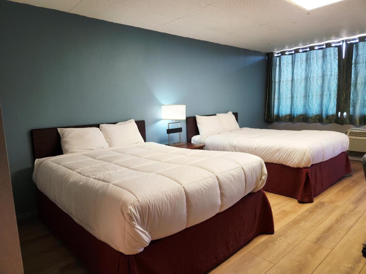 Executive Inn By Oyo Queenville Mena Exterior photo