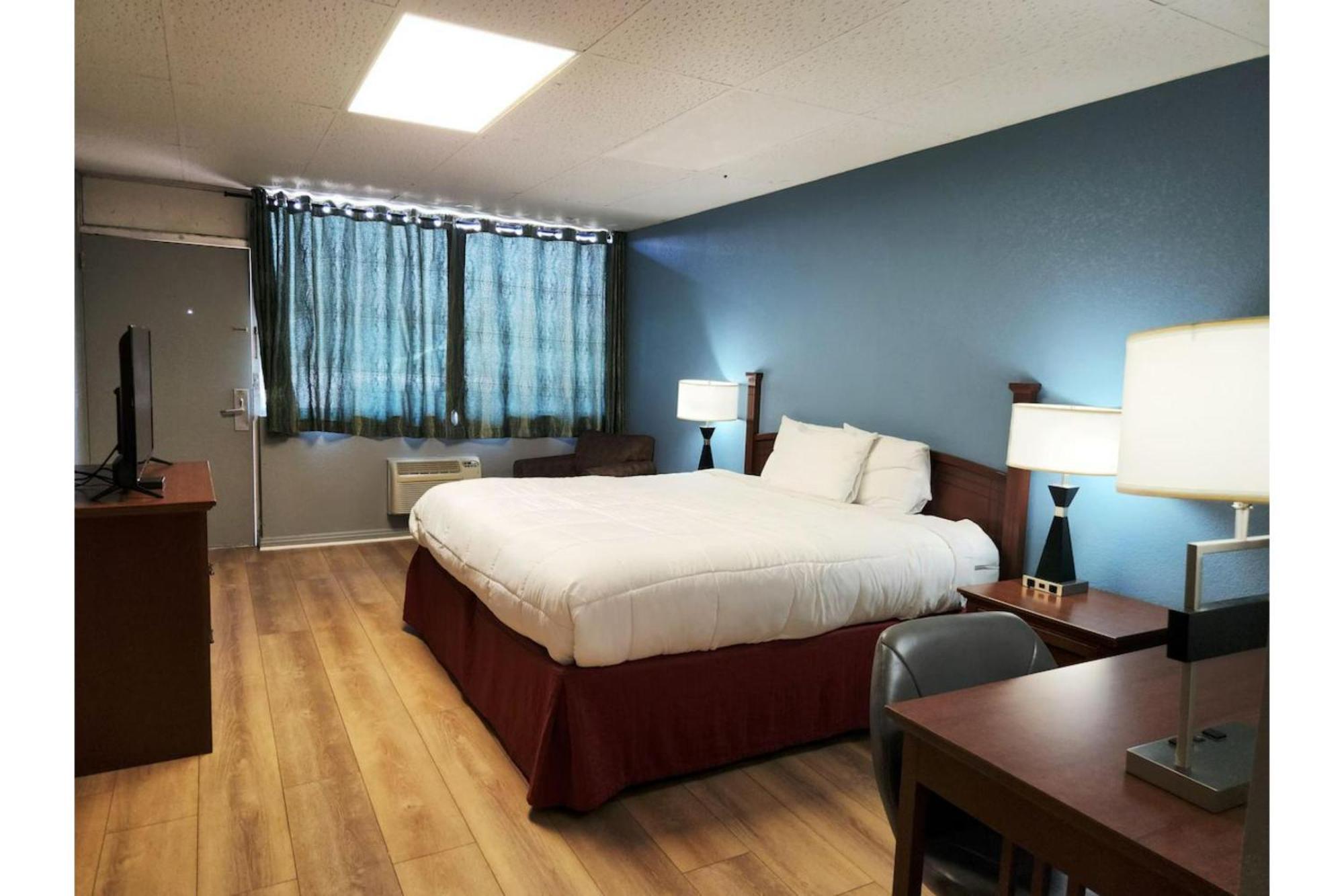 Executive Inn By Oyo Queenville Mena Exterior photo